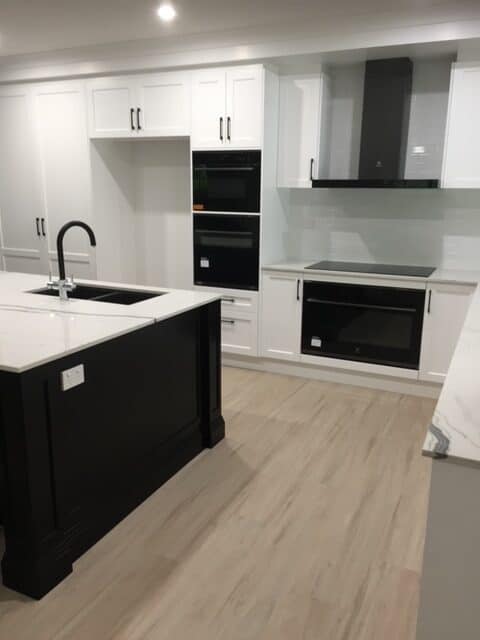 vinyl flooring in kitchen that replaced tiles