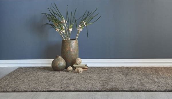 Plants in bronze vase — Flooring Experts in Brisbane, QLD